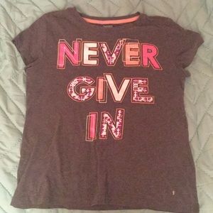 “Never give in” shirt